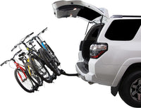 Four bikes loaded on the Saris Freedom 4-Bike Hitch Rack — mounted on SUV