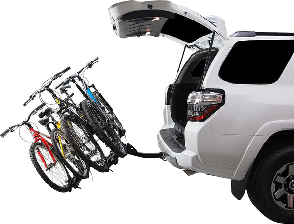 Four bikes loaded on the Saris Freedom 4-Bike Hitch Rack — mounted on SUV