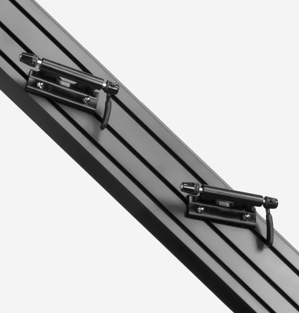 Saris Traps TR1 fork-mount carrier — fork dropout clamped into black mount close-up
