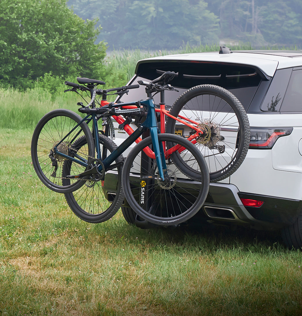 Saris SuperClamp G3 2-Bike Hitch Rack — loaded with two bikes on SUV