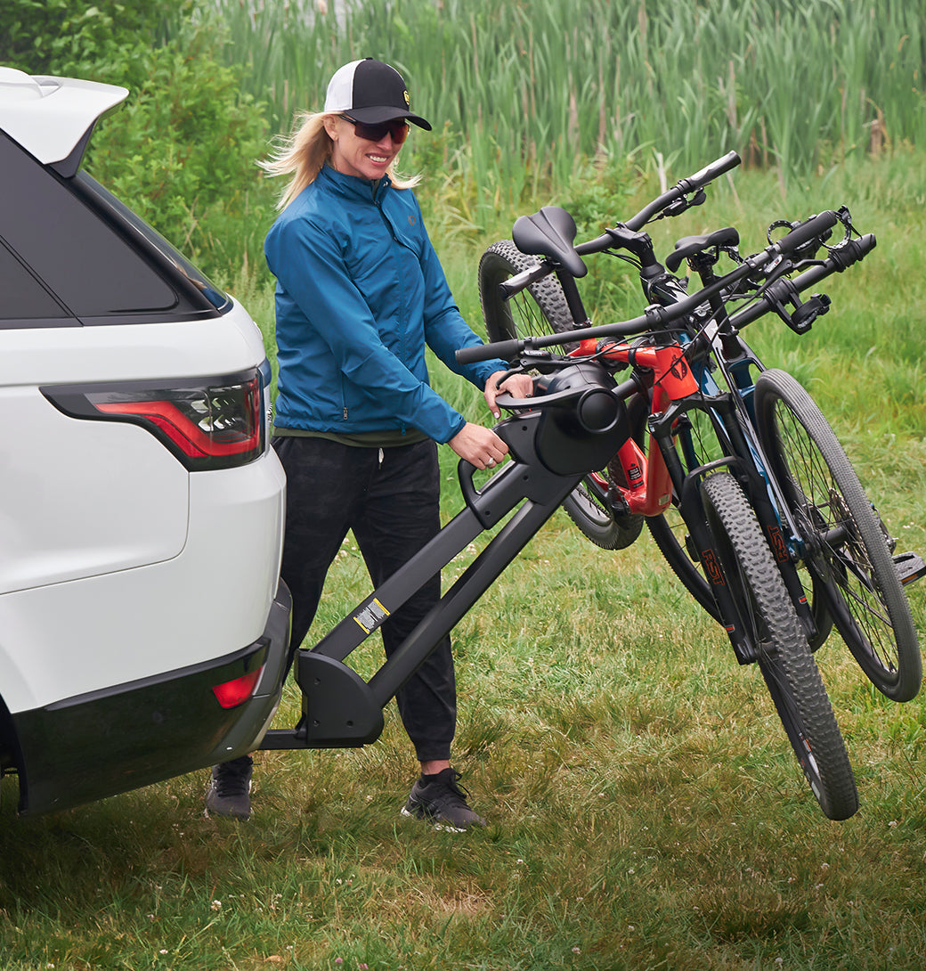 Saris SuperClamp G4 2-Bike Hitch Rack installed on SUV — bikes loaded