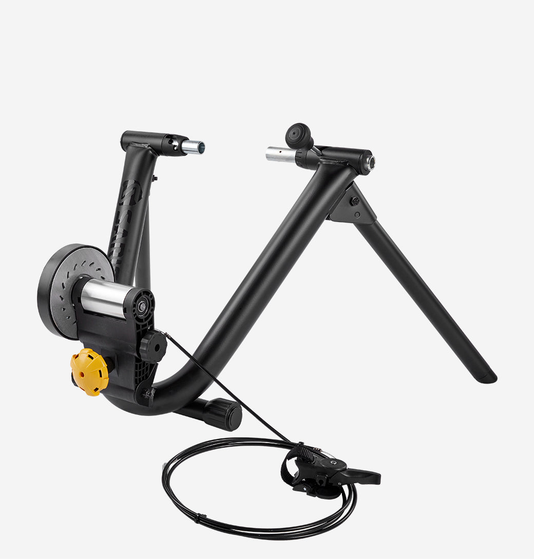 Saris MAG Plus Wheel-On Trainer — handlebar resistance knob and magnetic roller unit visible