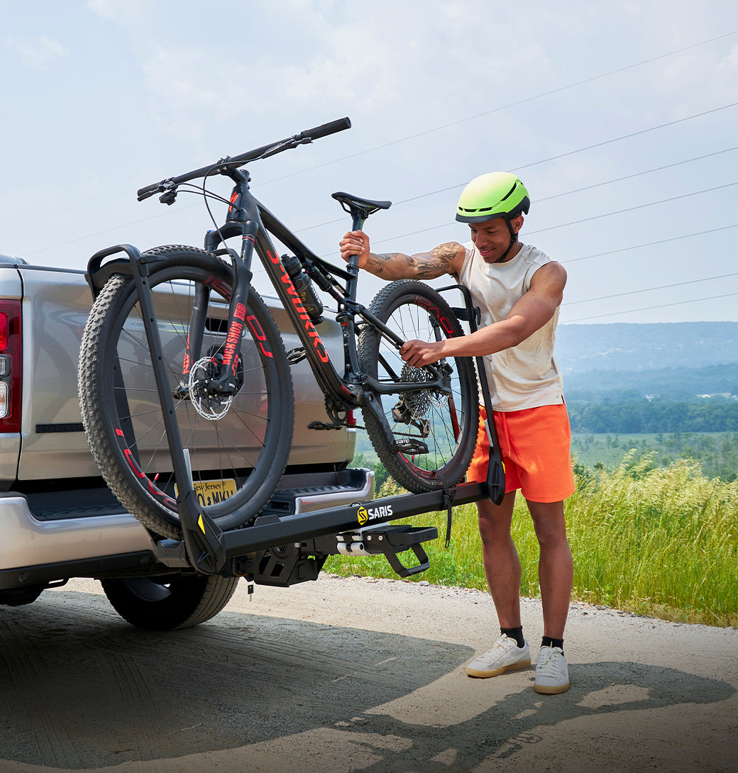 Saris MHS UNO 1-Bike Add-On Tray (SAR4661) — arm fully extended with ratchet wheel strap