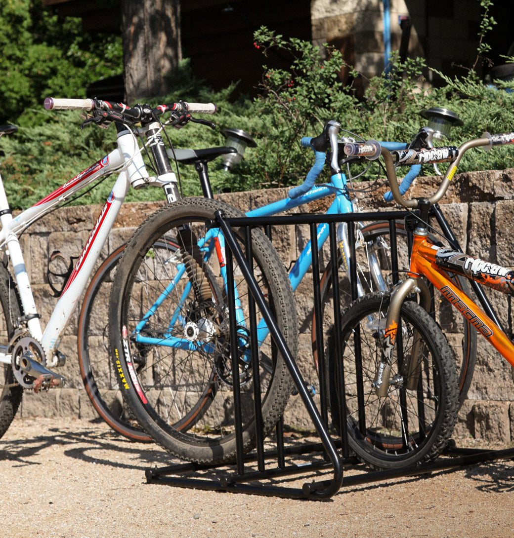 Saris Mighty Mite Bike Stand at outdoor event — road bike on display at trailhead