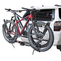 Saris SuperClamp G3 2-Bike Hitch Rack tilted down for cargo hatch access
