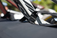 Saris Tailgate Pad — G-hook security strap looped through bike frame