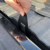 Saris Tailgate Pad — step 2 of installation: securing lower strap under bumper