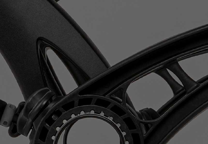 Saris Bones trunk rack — close-up of curved black polymer arm construction and ratchet knob