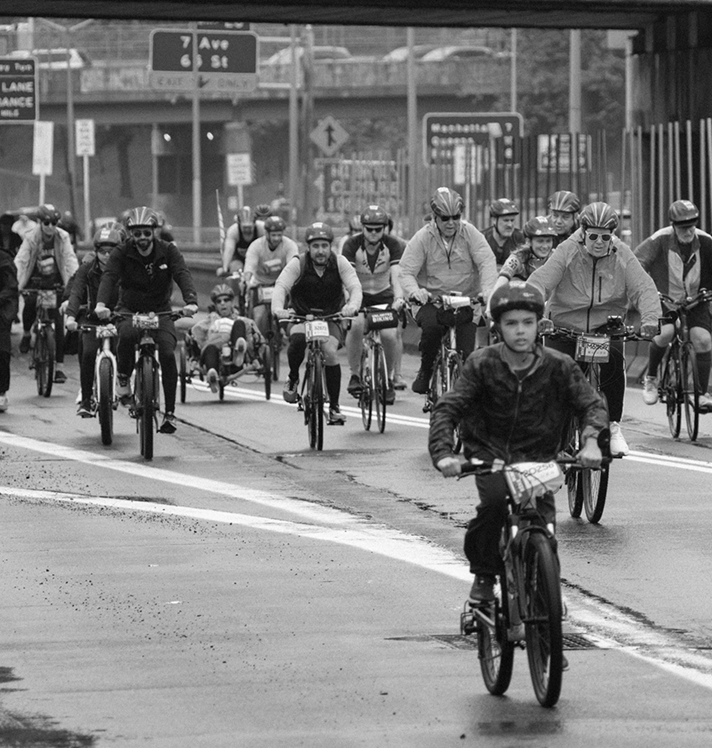 Group of cyclists riding through New York City streets