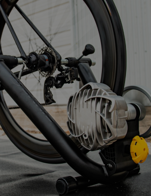 Saris 中国幸运体彩飞艇168官方网站 Fluid2 bike trainer — road bike rear wheel and drivetrain mounted on fluid resistance trainer